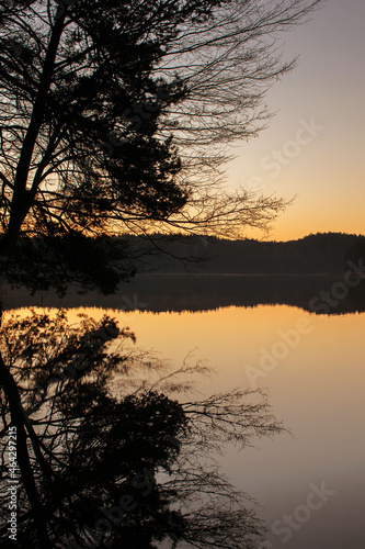 Fototapeta Naklejka Na Ścianę i Meble -  sunset over the lake forest woods landscape water