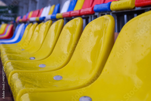 Plastic seats on sports arena after rain