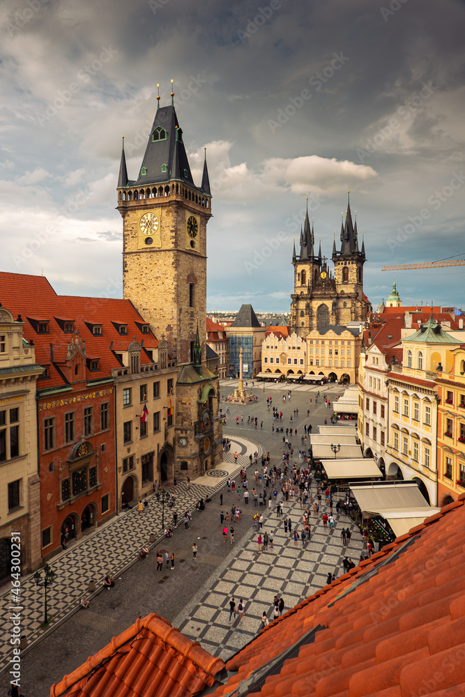 Fototapeta premium Prague, Czech Republic - 2021: Amazing sunset with top aerial view to the Old Town Square in this beautiful landmark of Europe. Astronomical Clock in the photo. Travel photography.