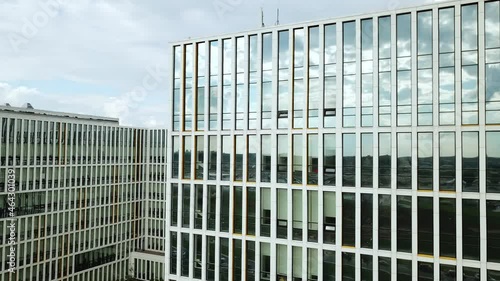 A modern hospital building with large mirrored windows photo