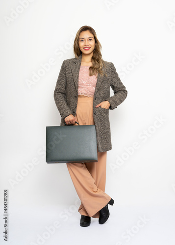 Portrait of smiling business woman with briefcase