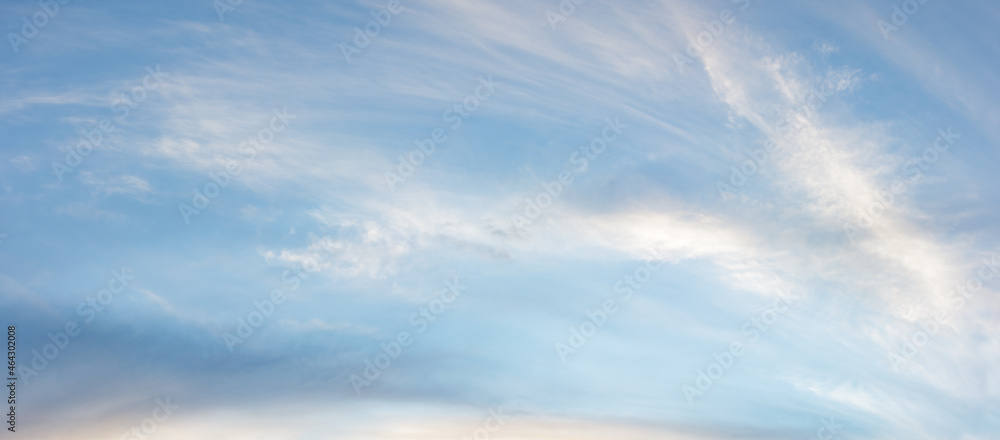 Wonderful fluffy evening clouds on blue sky Wonderful fluffy evening clouds on blue sky