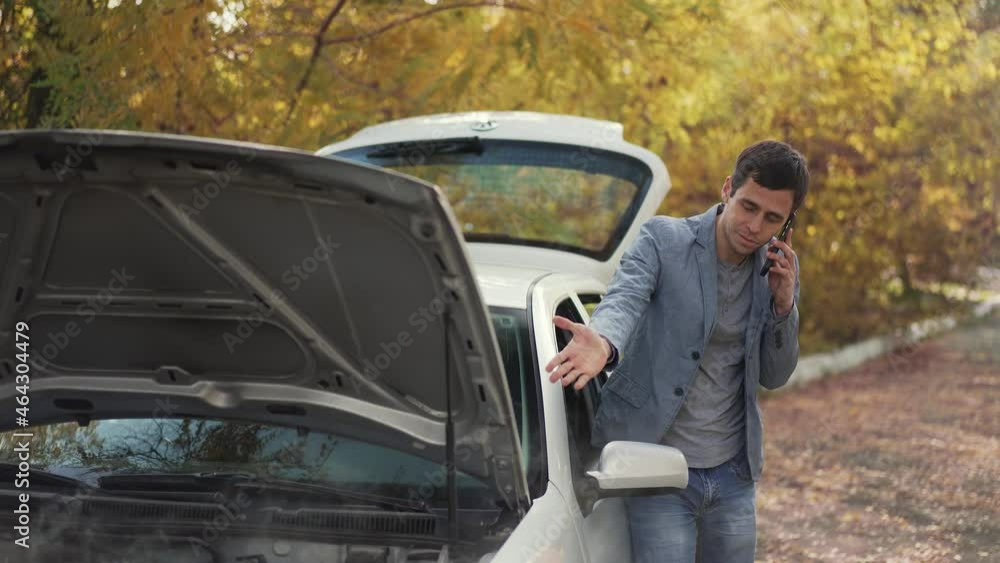 Man near broken car calling for help Man near broken car calling for help