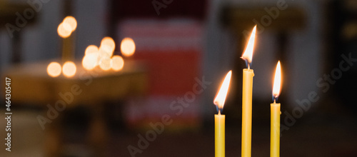 Burning candles in the church during the festive service on Christmas