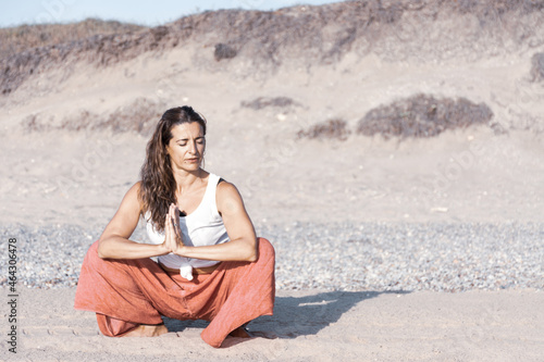 Woman doing the garland pose