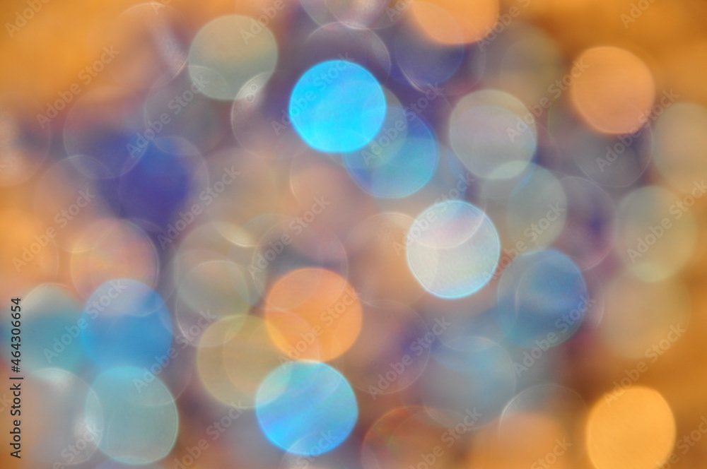 Obraz premium Glitter vintage lights background. gold, silver, blue and white. abstract blurred image.
