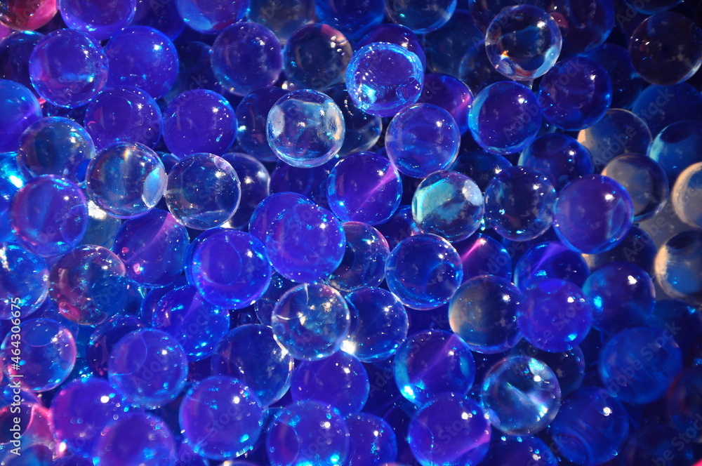 Navy blue water gel bubbles balls background.Transparent blue hydrogel