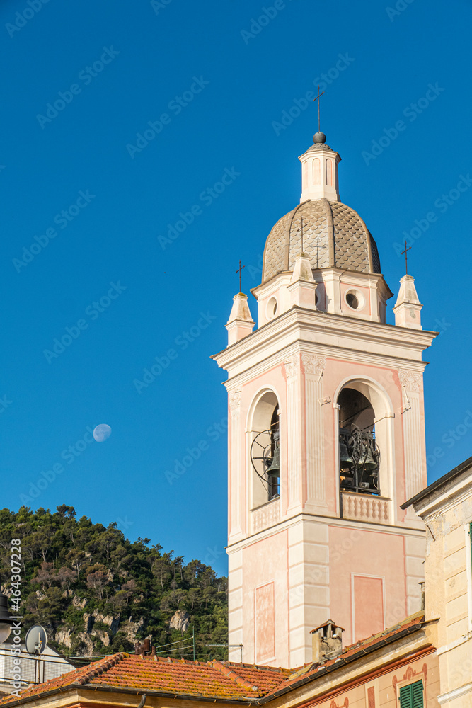 houses with beautiful facades and bell tower in Noli