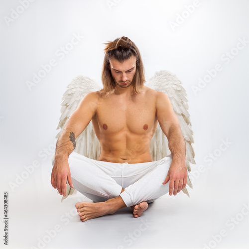 Handsome man angel. Isolated on white background.