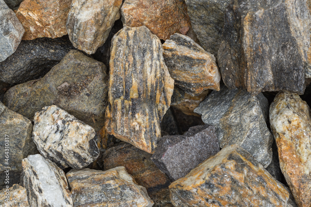 Decorative grit stone imitating tree bark. Natural decorative stone bark with golden shimmering threads as background