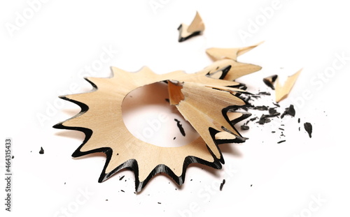 Wooden spiral shavings and tips from graphite pencil isolated on white background 