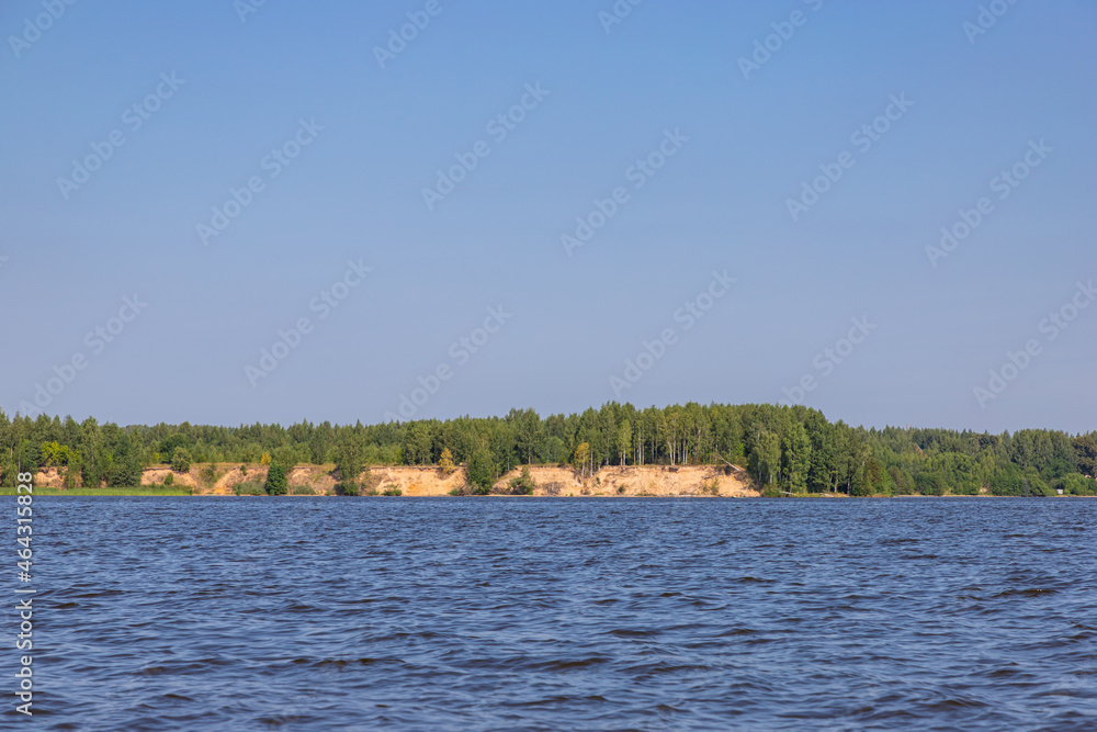 Beautiful view of the Unzha river with pine forest. Kostroma region. Summer tourist landscape.