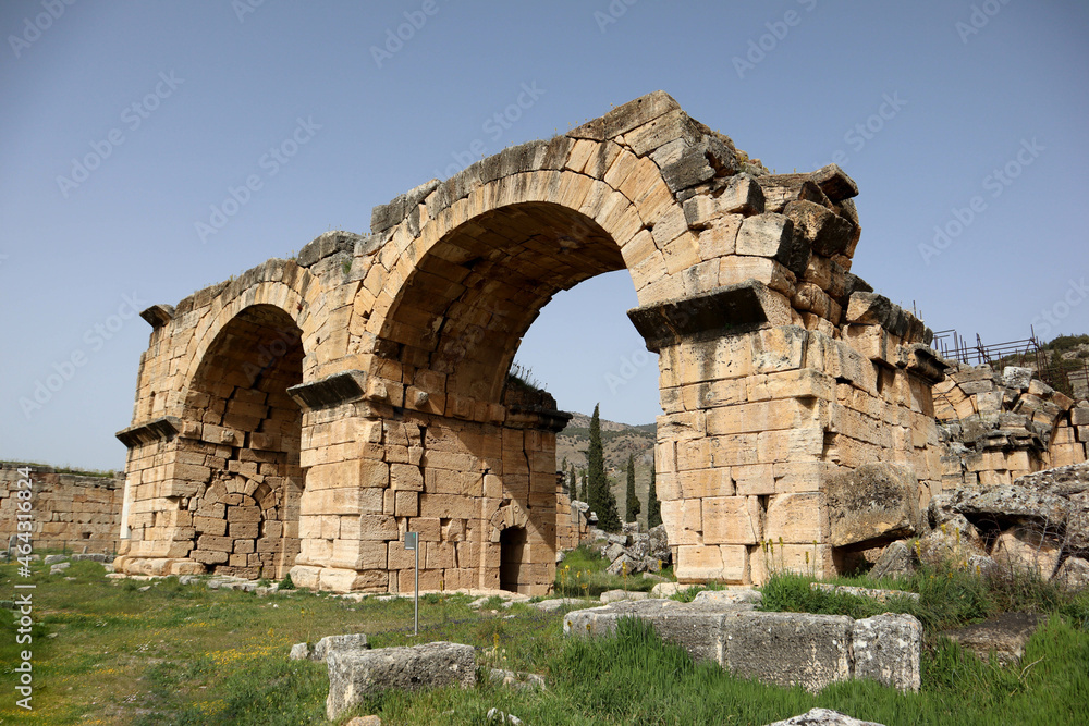 ruins of ancient arch in archaeological site Hierapolis, Pammukale, Turkey
