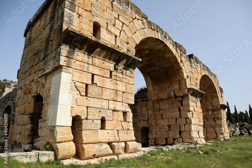 ruins of ancient arch in archaeological site Hierapolis, Pammukale, Turkey photo