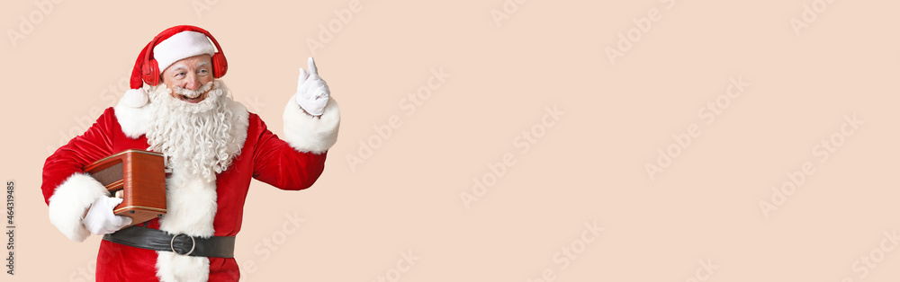 Portrait of Santa Claus with retro radio receiver on light background with space for text Portrait of Santa Claus with retro radio receiver on light background with space for text