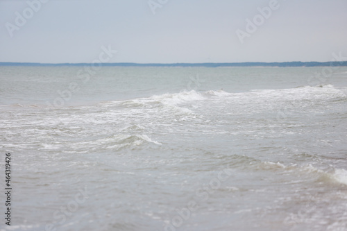 Seascape view of waves in Baltic sea. Photo taken on a warm overcast day.