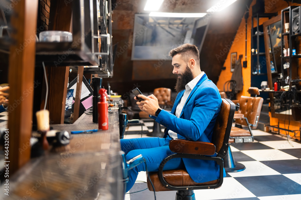 Young businessman in a suit at the barber shop Young businessman in a suit at the barber shop