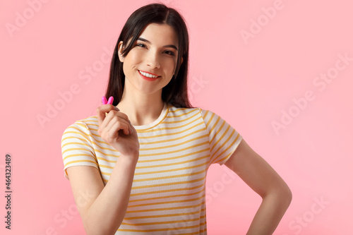 Pretty young woman with ear...