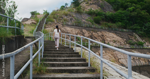 Photography Woman walking up to the mountain