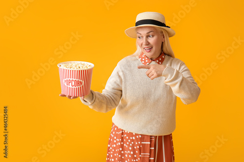 Mature woman pointing at ta...