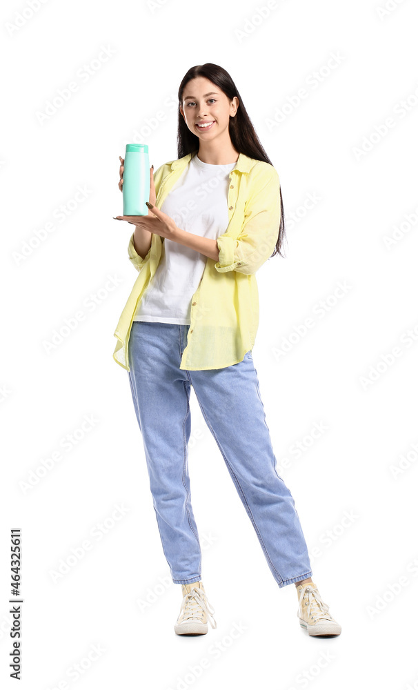 Beautiful teenage girl with bottle of shampoo on white background Beautiful teenage girl with bottle of shampoo on white background