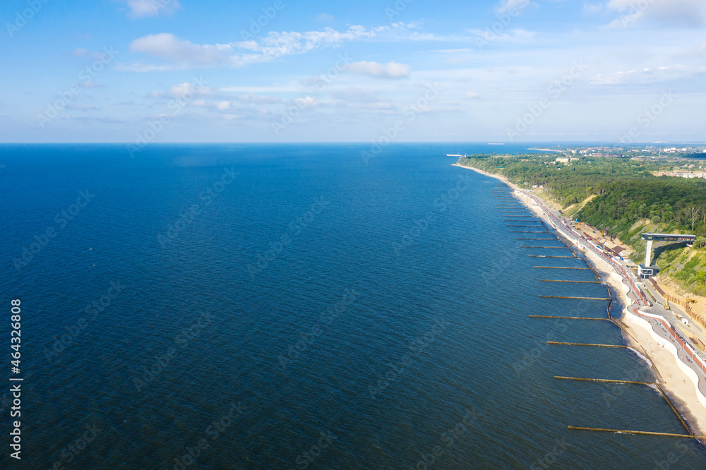 Summer Baltic Sea with embankment for promenade In Svetlogorsk. Kaliningrad region. Aerial view