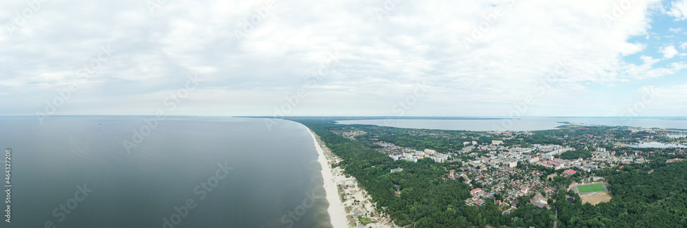 Baltic coastline with green summer forest and the sea. Baltiysk beach. Aerial view