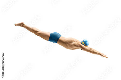 Vászonkép Male swimmer with swimsuit and cap jumping into water