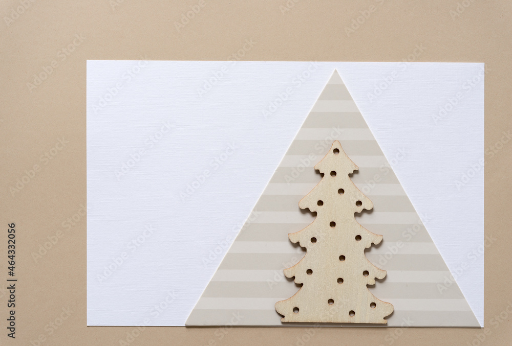 Fototapeta premium wooden christmas tree on paper triangle 