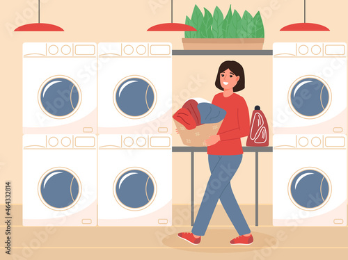 Happy woman holding basket with washed clothes at public laundry service. Self-service laundry with washing machines. Colored flat vector illustration.