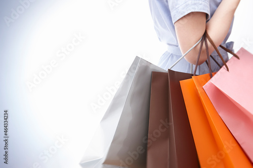 ショッピングバックを持つ女性の手 photo