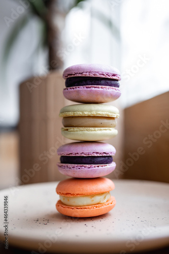 Macaroon cookies in a box on a wooden table