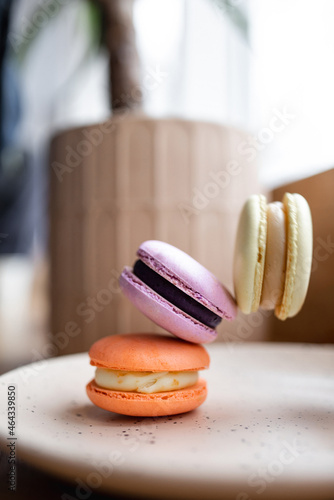 Macaroon cookies in a box on a wooden table
