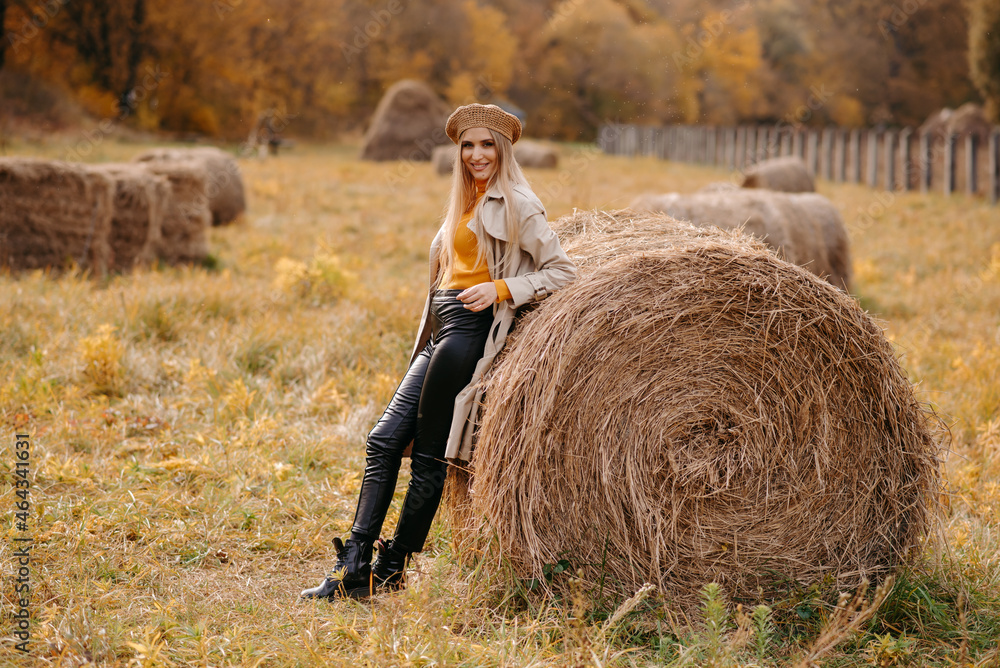 woman in a field with hay woman in a field with hay