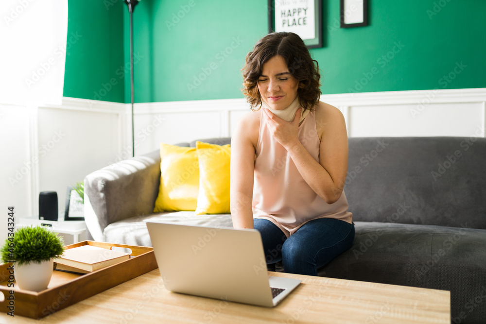 Injured woman working from home Injured woman working from home