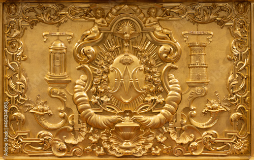 ROME, ITALY - AUGUST 30, 2021:  The baroque carved polychrome detail of altar  with the Litany of Loreto symbolic in the church Sant'Antonio dei Portoghesi.