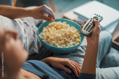 Couple watching TV at home