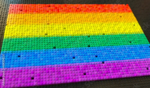 LGBTQ rainbow flag made with plastic toy blocks, conceptual 3d rendering