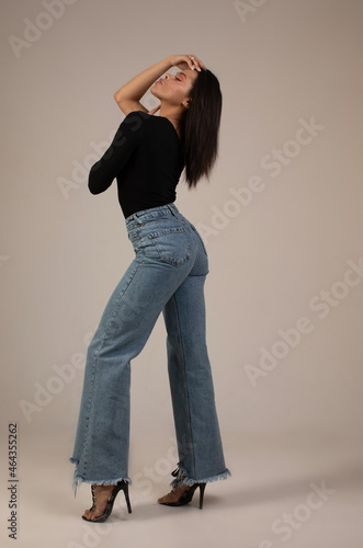 Black woman wear classic outfit isolated on grey background.