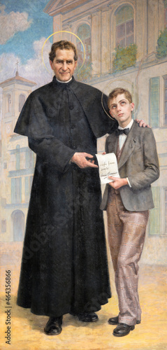 ROME, ITALY - AUGUST 31, 2021: The painting of St. Don Bosco and Dominic Savio in the church Chiesa del Sacro Cuore di Gesù by Paolo Giovanni Crida from 20. cent.