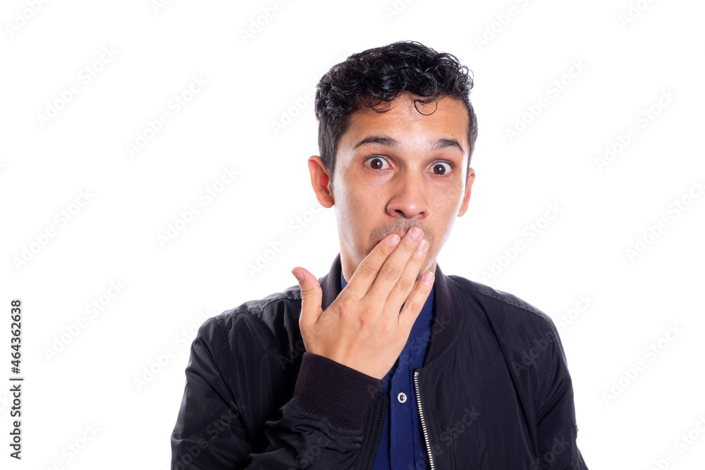 Man covering his mouth so as not to speak. White background. Surprised young man covers mouth with his hands, startled mute guy keep silent secret portrait. Man covering his mouth so as not to speak. White background. Surprised young man covers mouth with his hands, startled mute guy keep silent secret portrait.