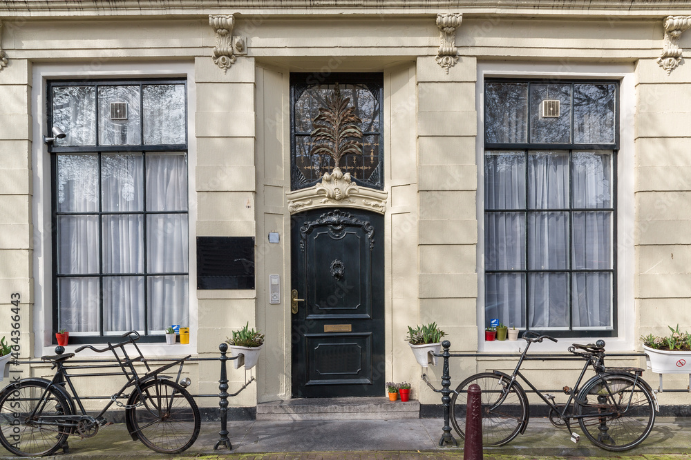 Two Bikes on the Sidewalk in Front of an Elegant Flat in Amsterdam, The Netherlands
