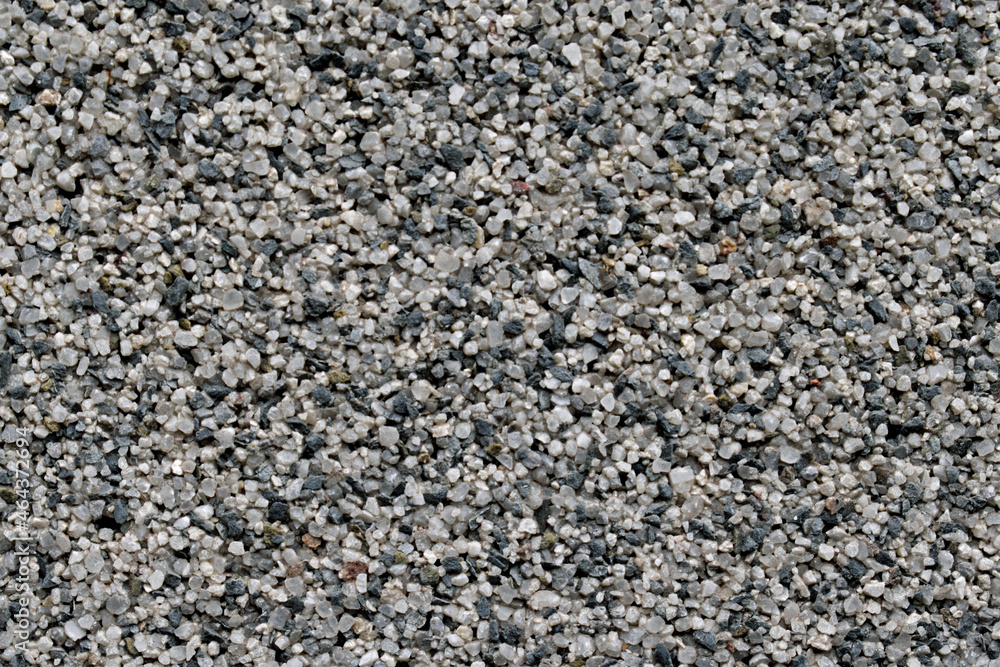 Fine gravel wall texture with pieces of different colors closeup Fine gravel wall texture with pieces of different colors closeup