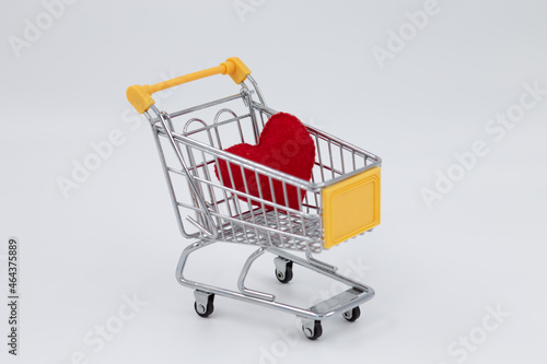 Model metal shopping cart, red sponge heart inside