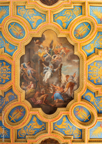 ROME, ITALY - SEPTEMBER 2, 2021: The fresco of Martirdom of St. Anastasia of  Sirmio on the ceiling of church Basilica di Santa Anastasia by Michelangelo Cerruti (1722). photo