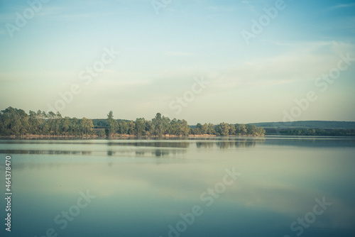 The sunset (dawn) is beautiful on the river, pond, lake beyond Moscow. © Ilya