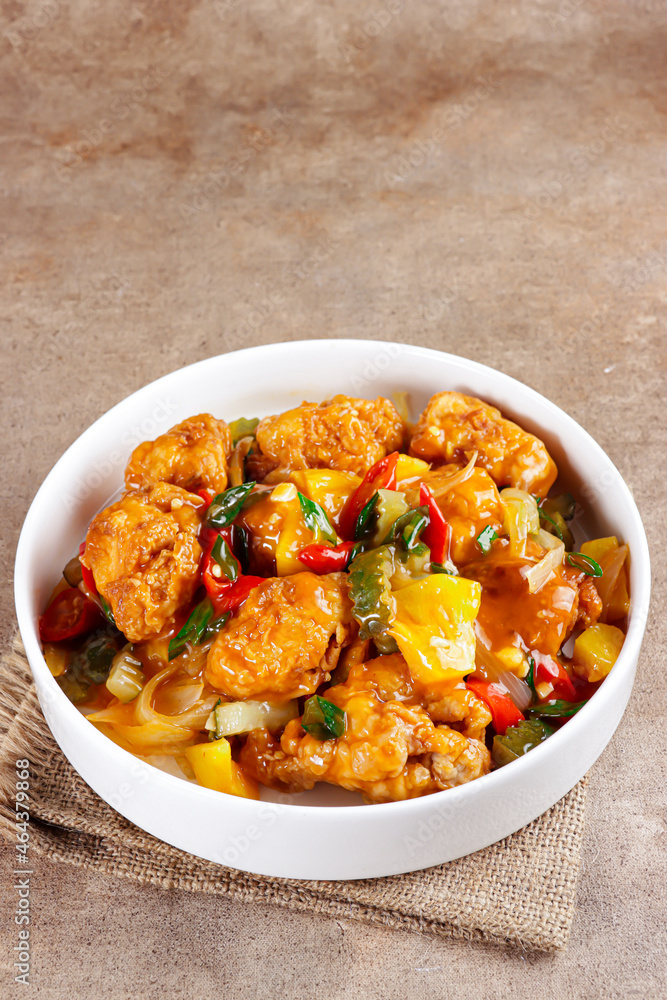 Ayam Koloke or Kuluyuk Chicken, is a Chinese Indonesian dish made from crispy chicken seasoned with red sweet and sour pineapple sauce. Popular as Ayam Asam Manis Ayam Koloke or Kuluyuk Chicken, is a Chinese Indonesian dish made from crispy chicken seasoned with red sweet and sour pineapple sauce. Popular as Ayam Asam Manis
