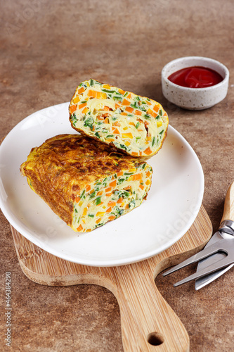 Telur dadar gulung. Tamagoyaki or Japanses egg roll. Gyeran Mari or Korean Rolled Omelette photo