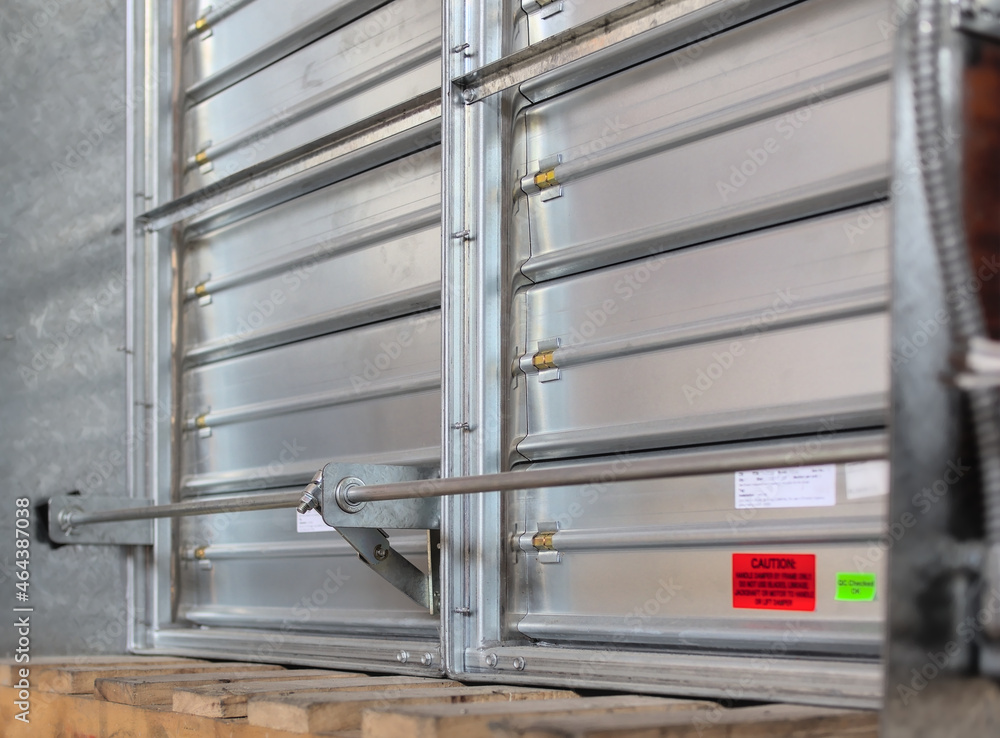 Motorized fire damper with its flaps isolated. Motorized fire damper with its flaps isolated.