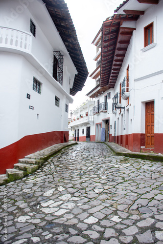 Cuetzalan street with red and white buildings photo